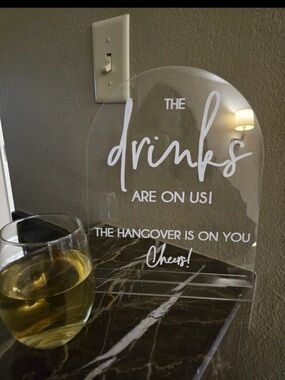 Clear Acrylic 'Drinks Are On Us' Sign - White Lettering